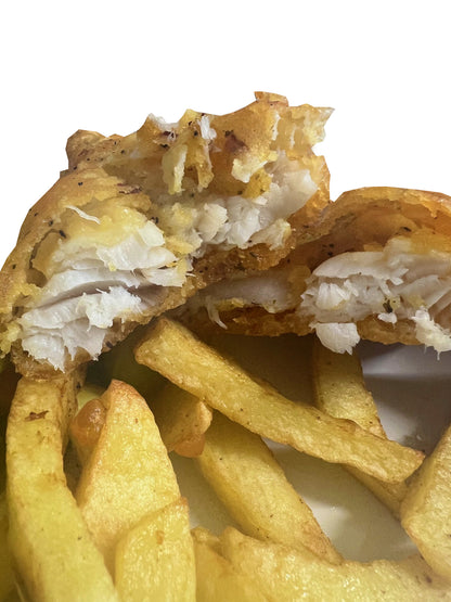 Homemade Battered Cod Fish with a portion of Chips with a can of Pepsi