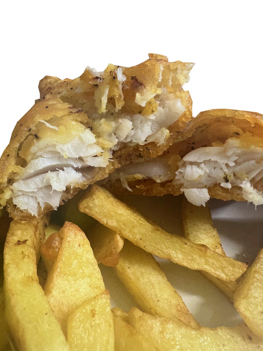 Homemade Battered Cod Fish with a portion of Chips with a can of Pepsi